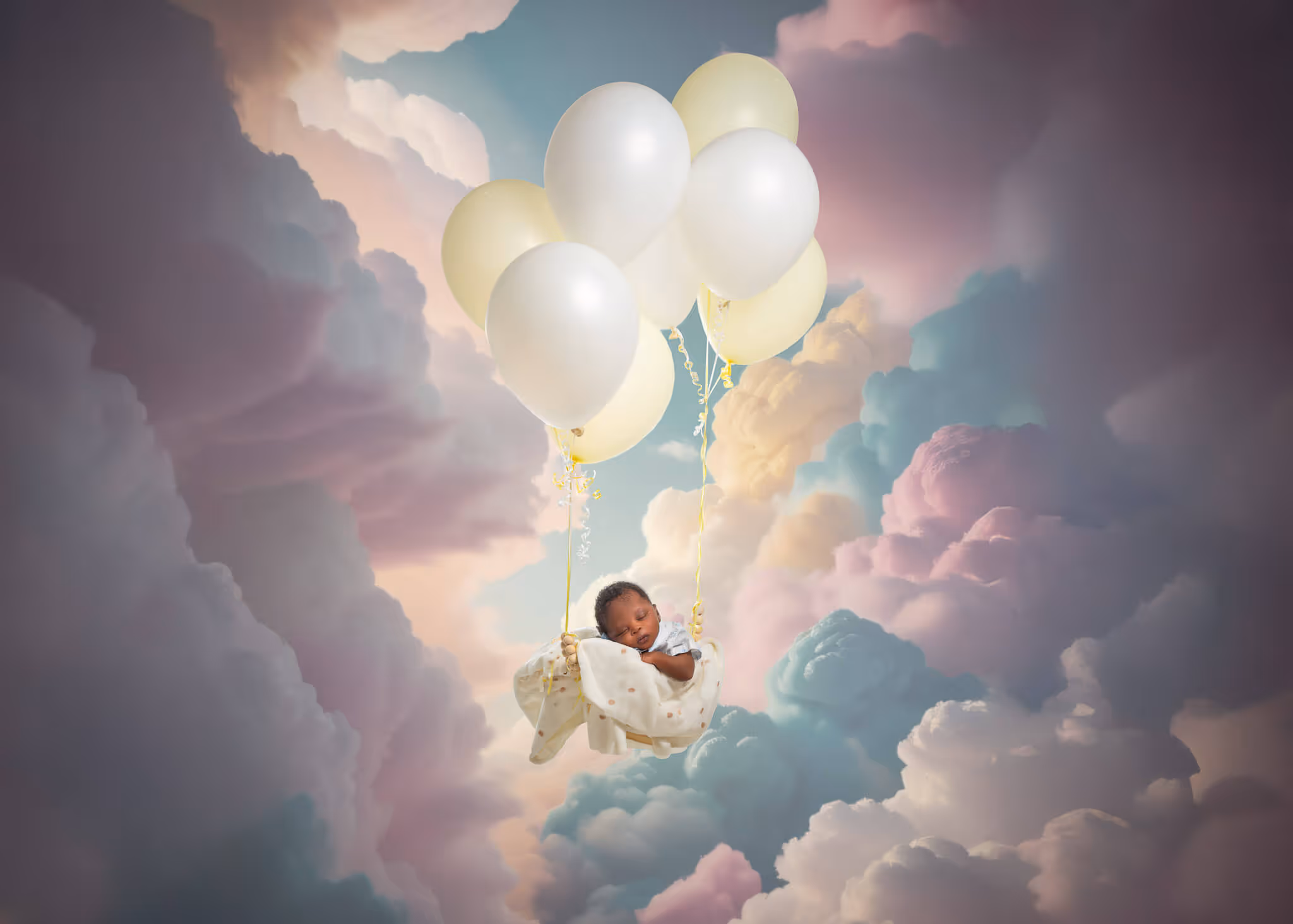 Sleeping baby cradled in a cloth suspended by white balloons floating among colorful clouds.